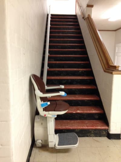 Outdoor stairlift on covered porch steps in Utah