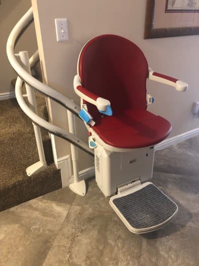 Curved stairlift rail following unique spiral staircase design