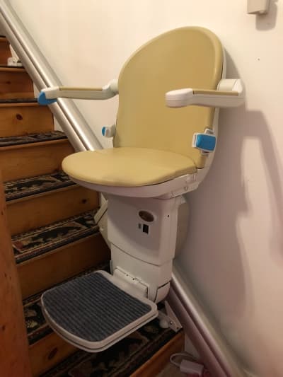 Stairlift charging station at base of stairs